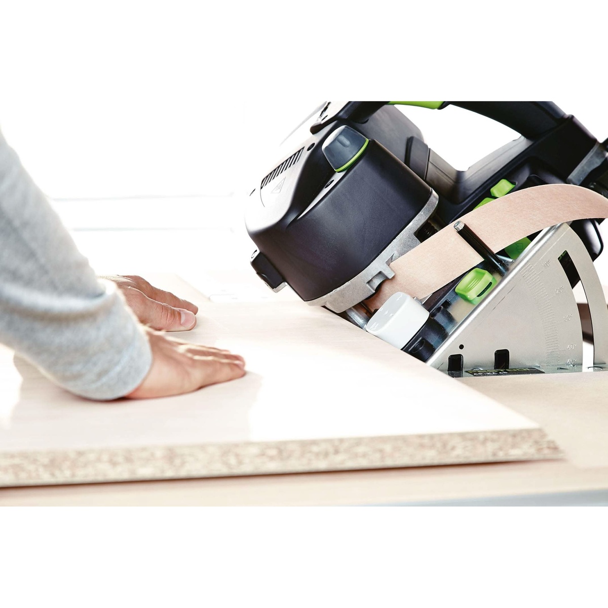 Festool 500869 MFT/3 CONTURO Edge Bander Table applying edge banding to a beveled panel in a woodworking shop