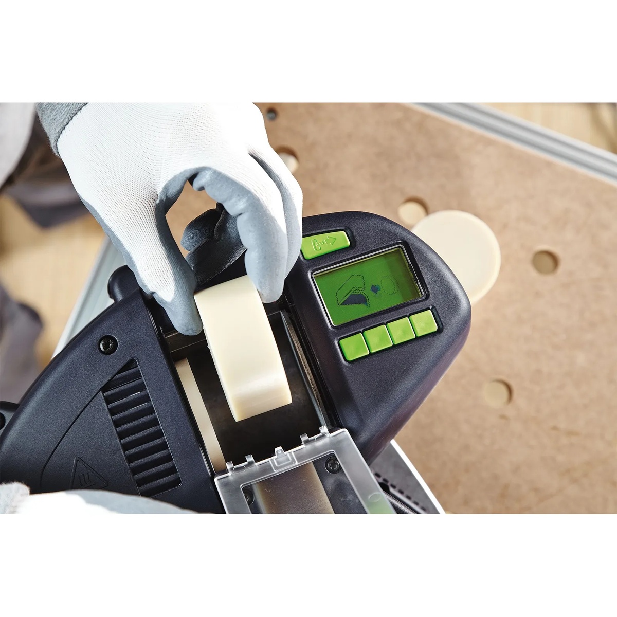 Festool 499812 Natural EVA Edge Banding Adhesive for Conturo, 48 Pack being loaded into a Festool CONTURO KA 65 edge bander during edge banding setup on a workshop bench