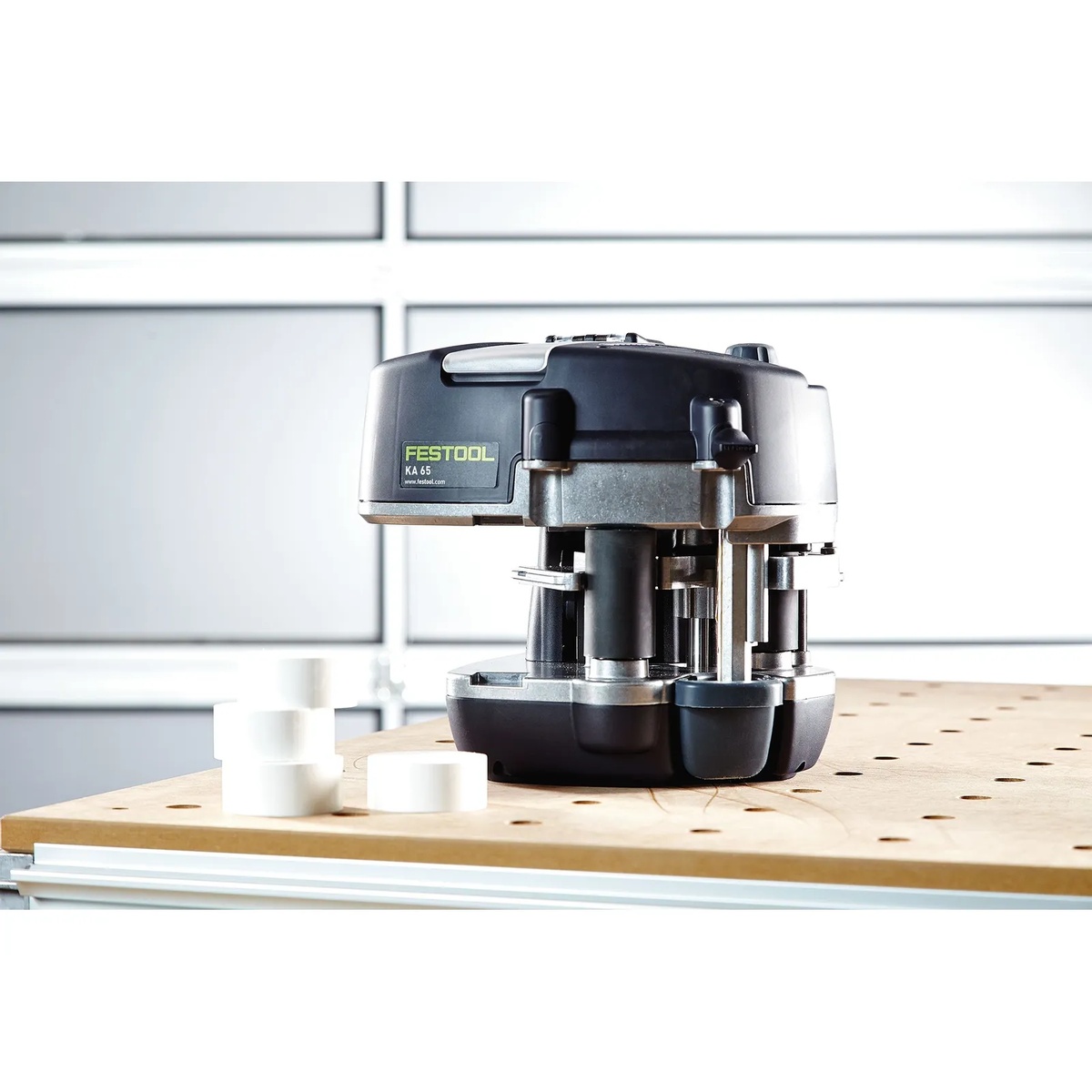 Festool 499813 White EVA Edge Banding Adhesive for Conturo, 48 Pack shown next to a Festool CONTURO KA 65 edge bander on a woodworking bench in a cabinet shop setting