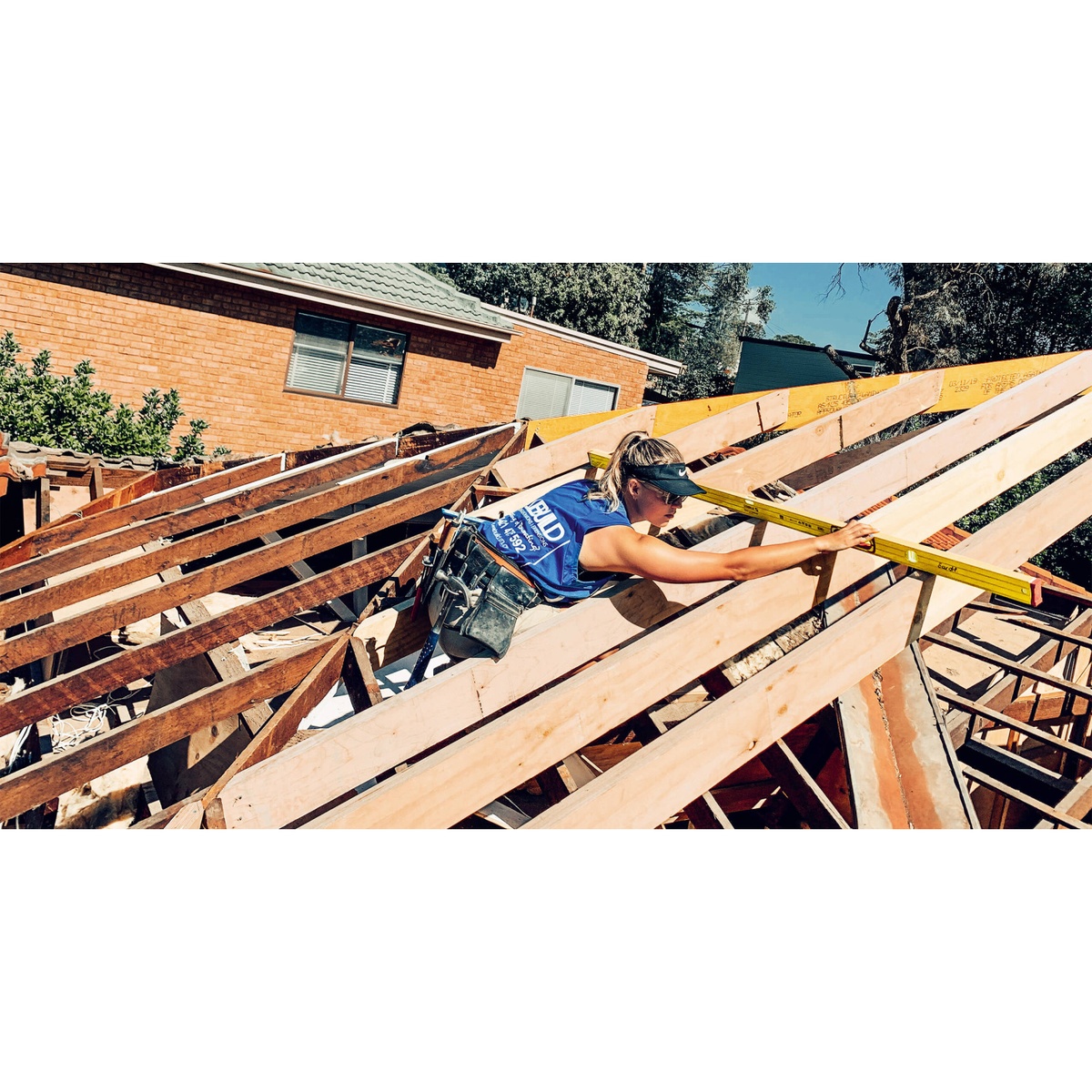 Stabila 37816 48-inch & 16-inch Type 196 2-Piece Spirit Level Set being used to check roof framing alignment on a residential construction jobsite