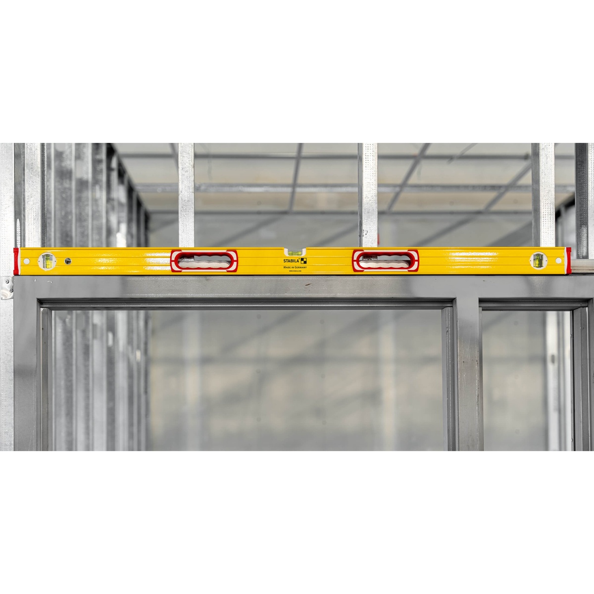 STABILA Type 96 M Mag Jamber Set 78 inch magnetic box-beam level spanning a metal door frame opening for leveling and alignment