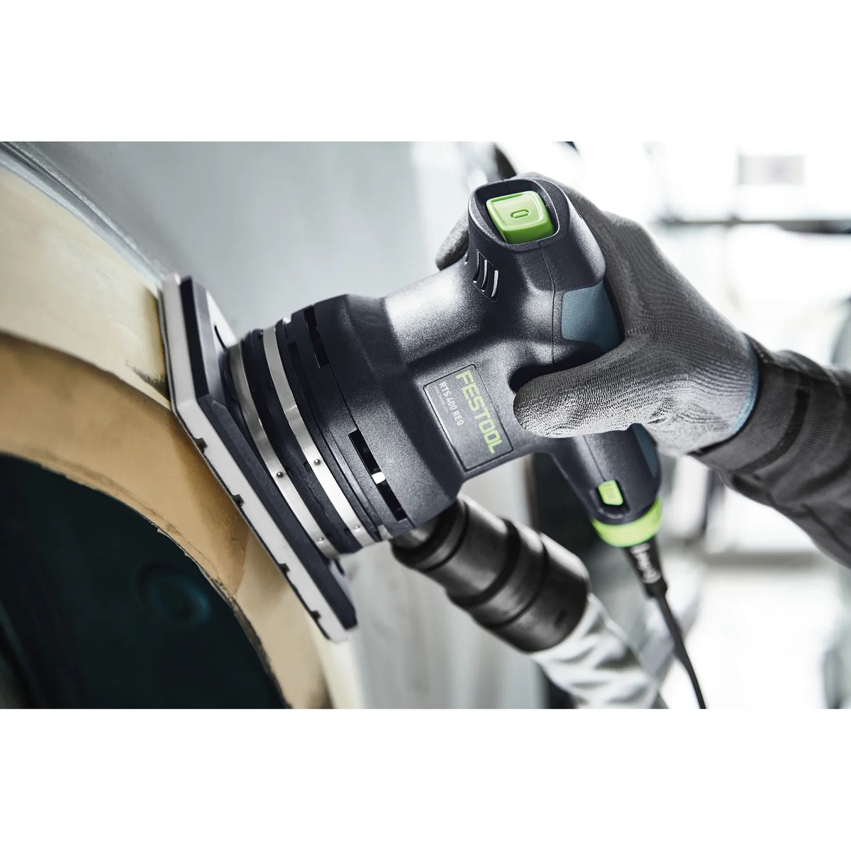 Festool 489252 SSH 80x130 sanding pad in use on a Festool finish sander sanding a curved surface with dust extraction connected
