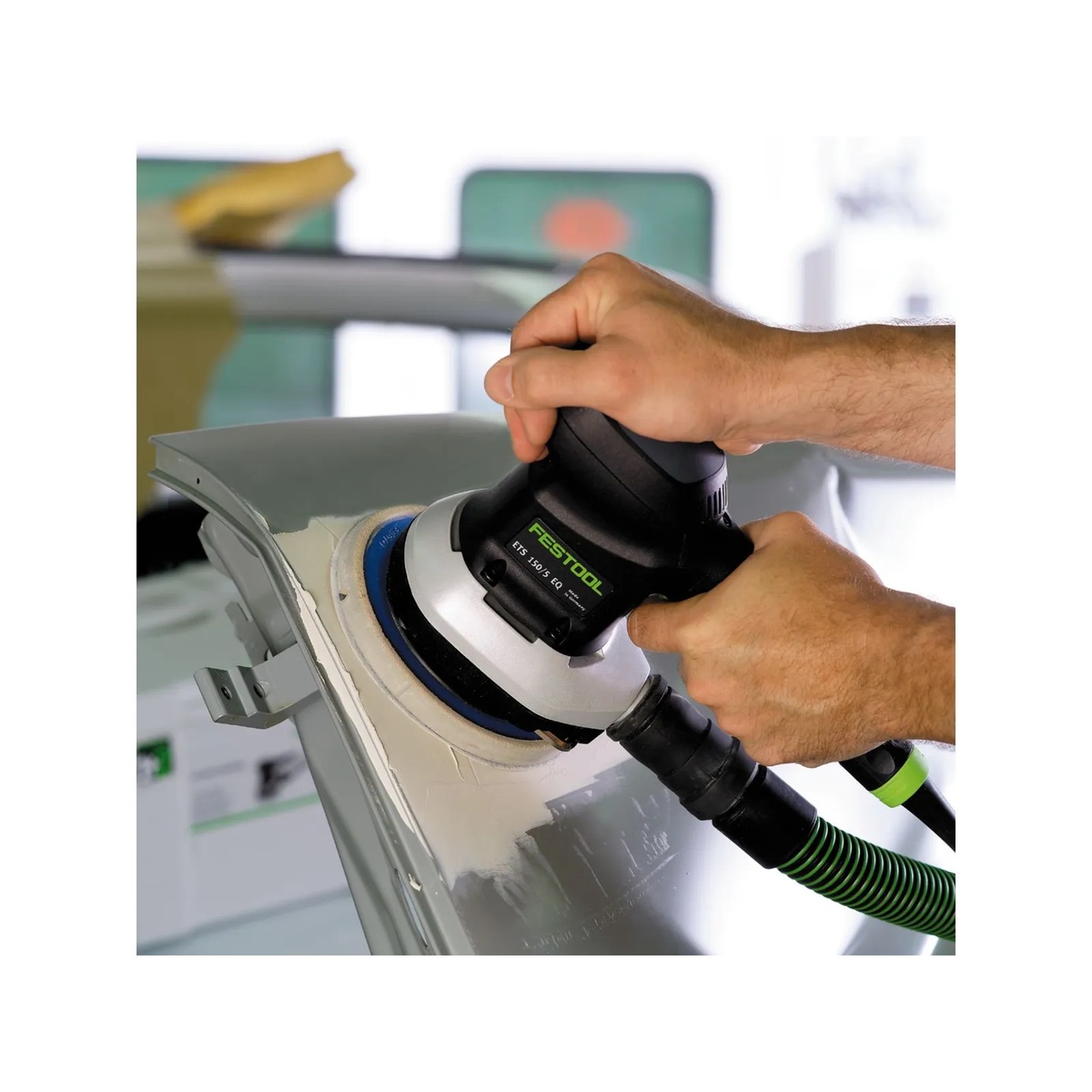 Festool 492127 RO125 FEQ StickFix Sanding Pad, Hard, 125mm (5 inch) used with dust extraction while sanding an automotive panel in a workshop