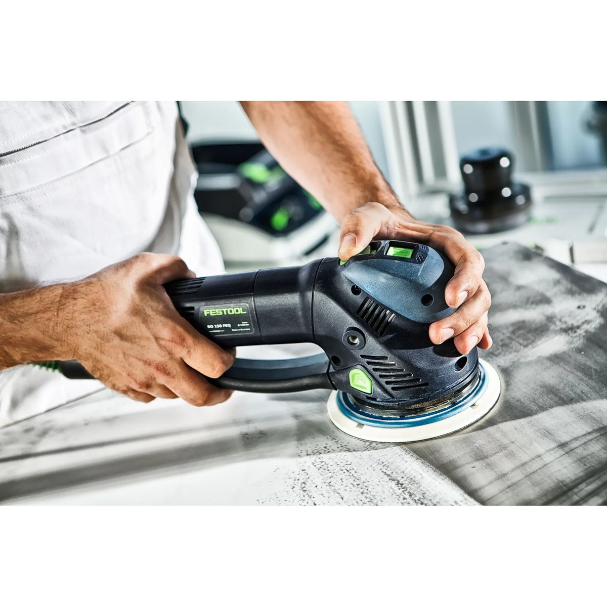 Festool 492127 RO125 FEQ StickFix Sanding Pad, Hard, 125mm (5 inch) installed on a Festool sander while sanding a flat work surface during finish preparation