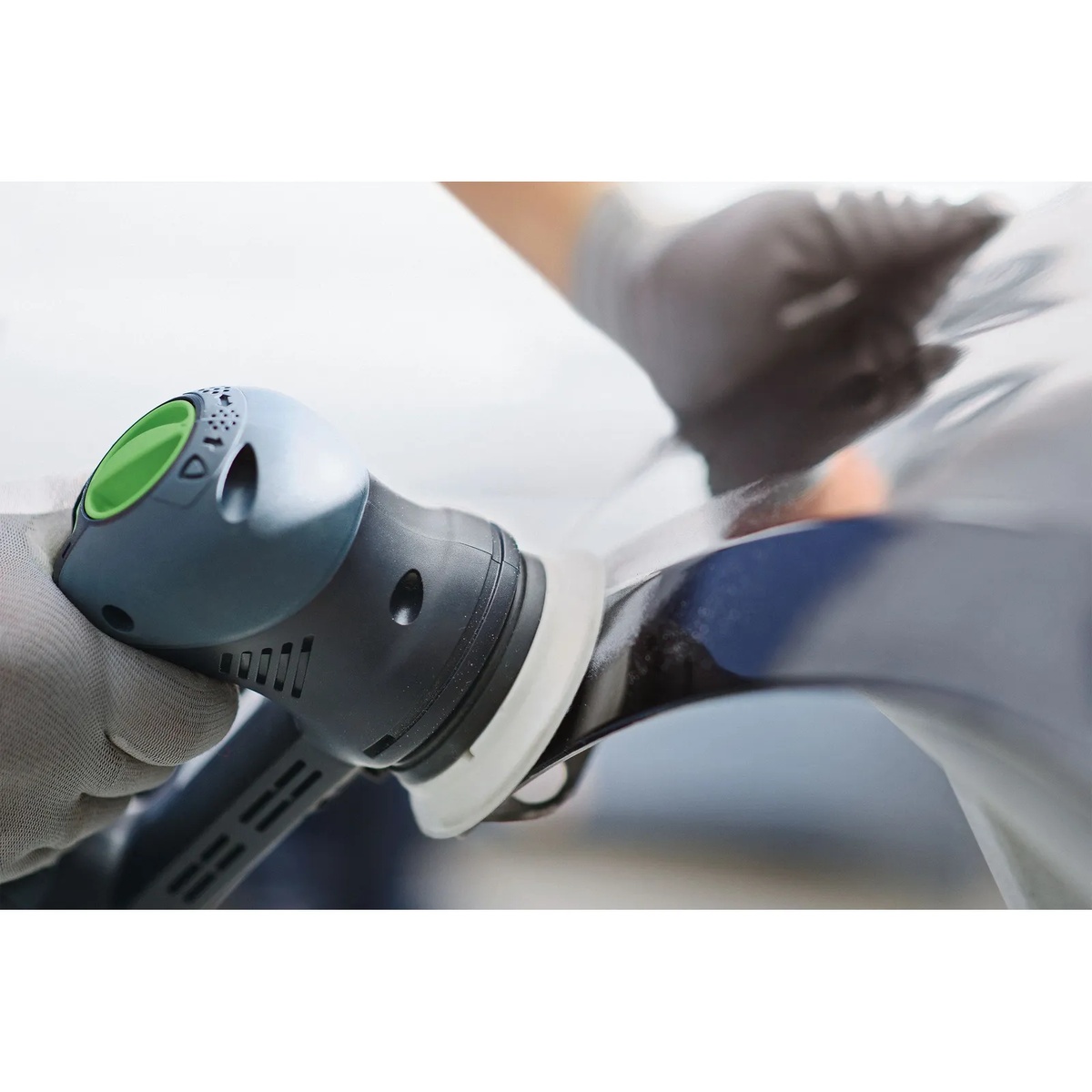 Festool 496804 3-1/2 in. Soft Pad for RO 90 DX(standard pad) sanding a curved painted surface with a Festool RO 90 DX in finish-prep work
