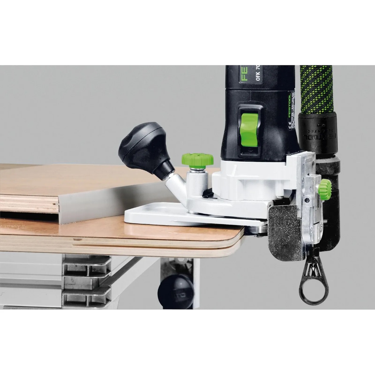 Festool 491427 Zero Degree Horizontal Base MFK 700 installed on a Festool edge router trimming the edge of a wood panel on a workbench