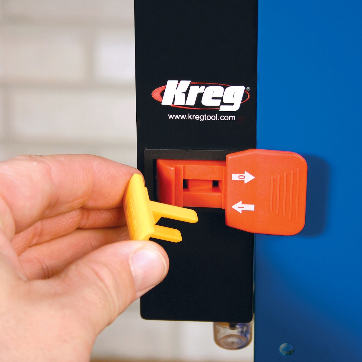 Kreg PRS3100 Multi-Purpose Router Table Switch Key-Lok safety key being removed to prevent accidental power-on on a router table setup