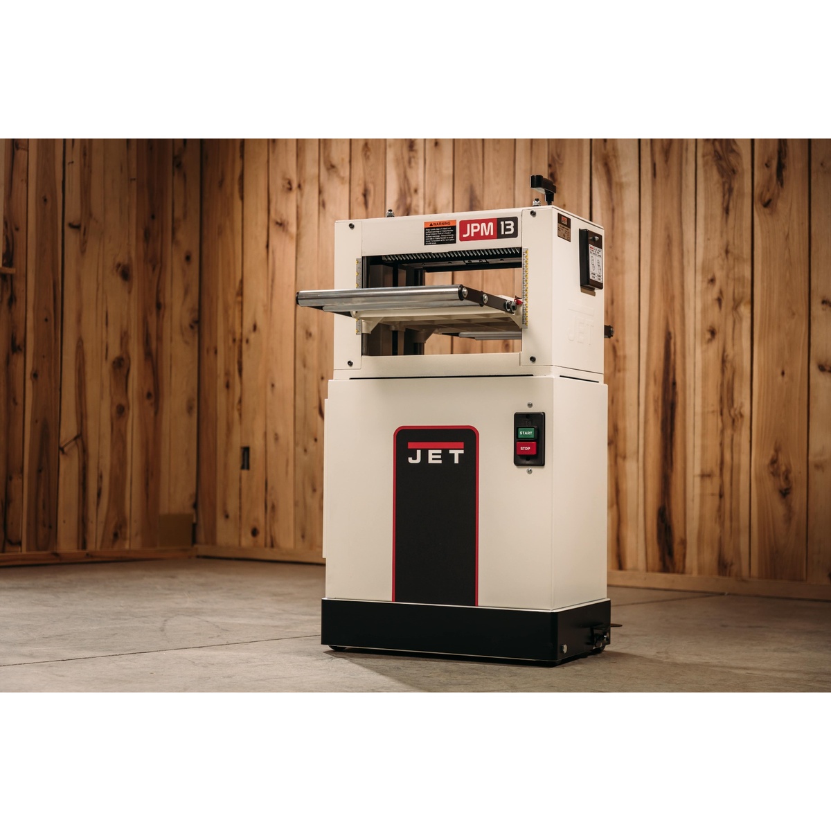 Jet JPM-13CS 13 inch Closed Stand Planer / Molder set up in a woodworking shop for planing and molding work