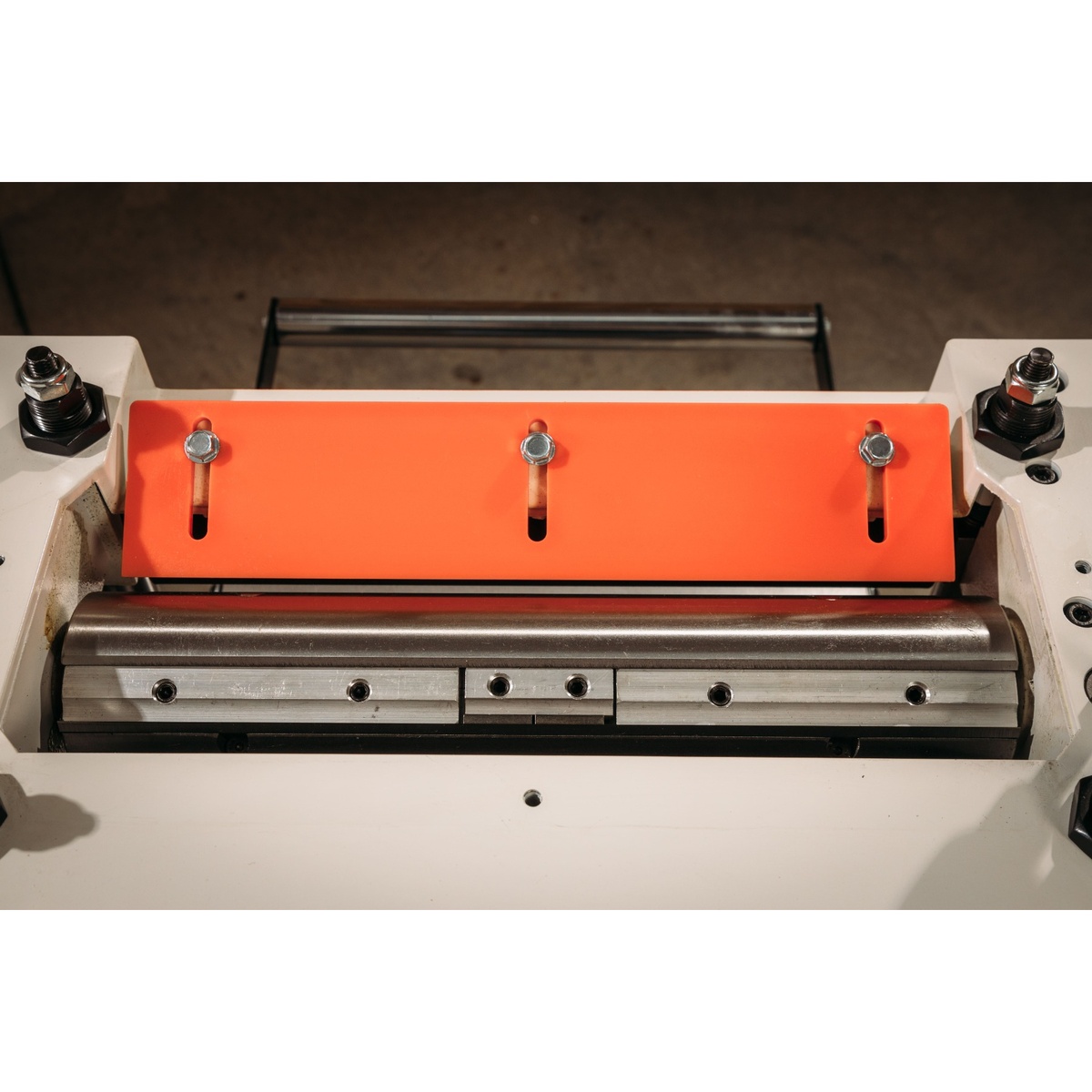 Jet JPM-13CS 13 inch Closed Stand Planer / Molder cutterhead close-up showing the three-knife cutting assembly