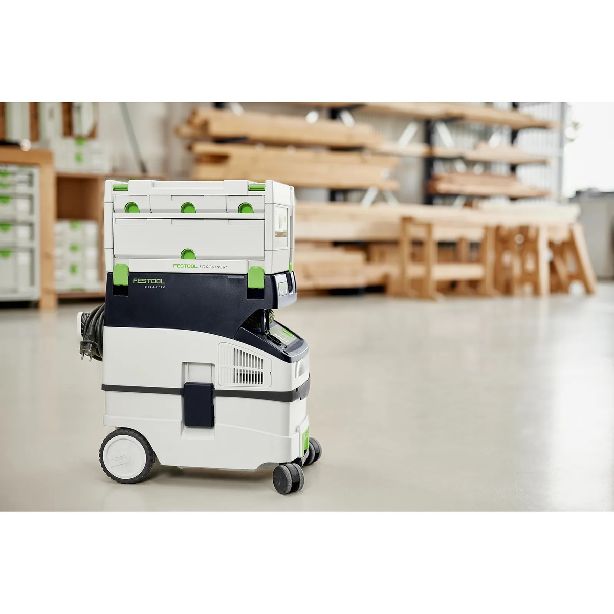 Festool 491522 4-Drawer Sortainer stacked on a Festool CT dust extractor in a woodworking shop for transport and organized storage