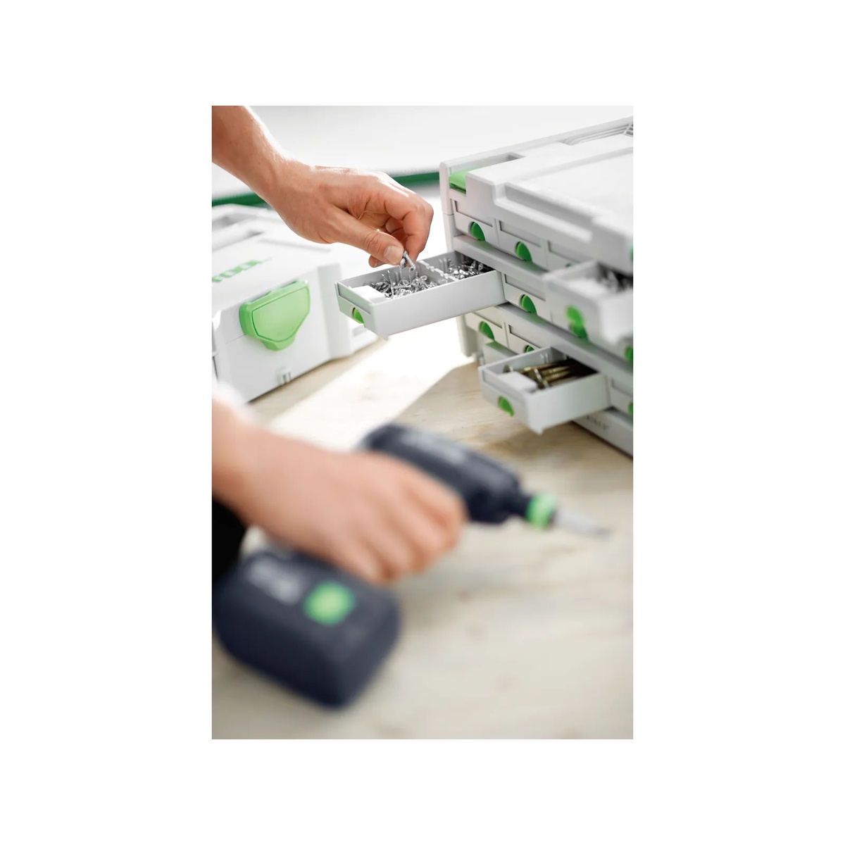 Festool 491984 6-Drawer Sortainer in use on a workbench with a user pulling hardware from a drawer during fastening work