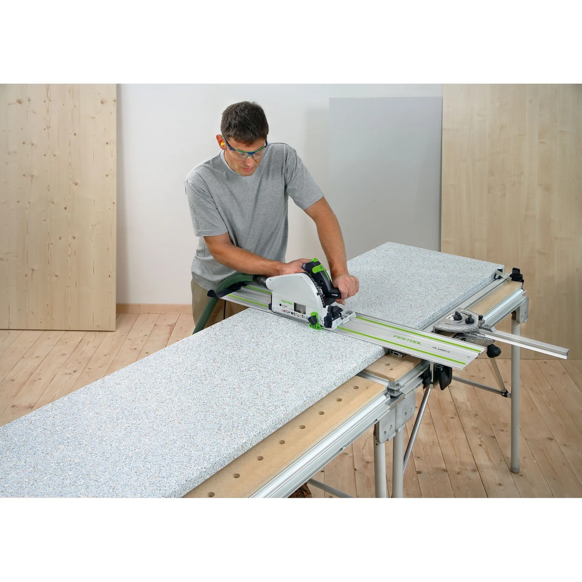 Festool 484455 MFT Connector used with connected Festool multifunction tables to support large panel cutting with a track saw in a workshop setting