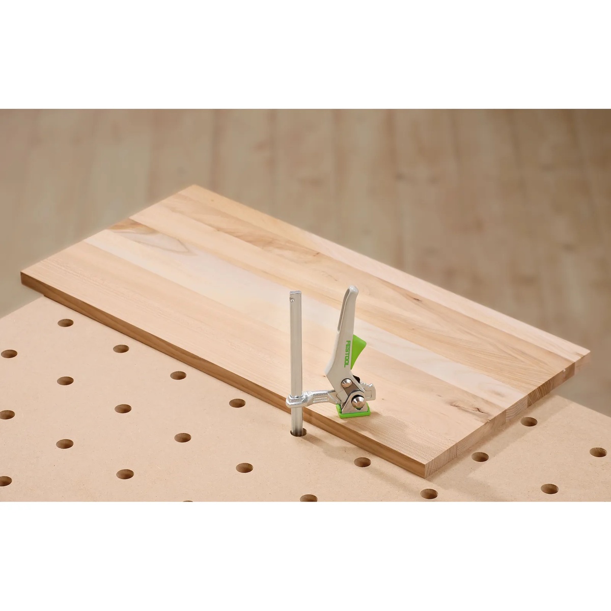 Festool 495315 MFT/3 Multifunction Table securing a solid wood panel with a vertical clamp for assembly and trimming