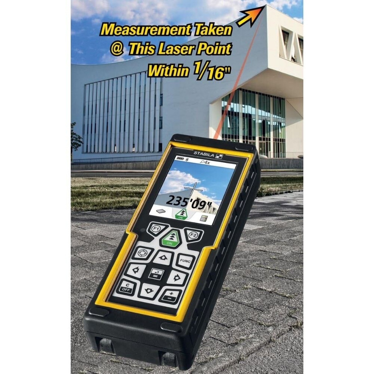 Stabila 06520 laser distance measurer targeting a distant exterior building point for long-range measurement on a jobsite