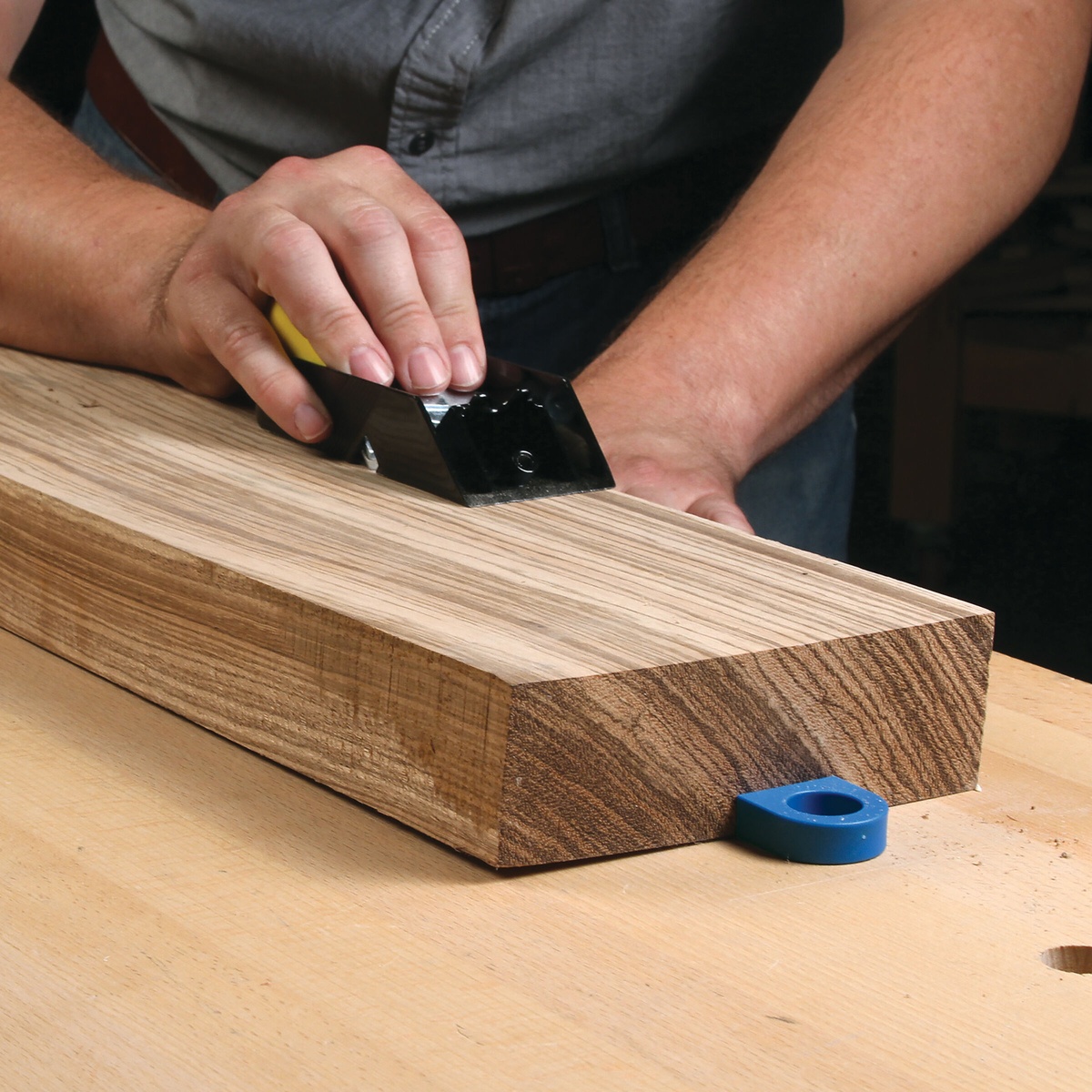 Workbench setup using Kreg Bench Dogs and Bench Brakes (4-Pack) to stop a hardwood board from moving during hand tool work