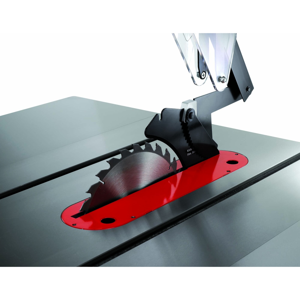 Jet 708675PK Deluxe Xacta SAW 3HP, 1Ph, 50 inch Rip blade and guard assembly above the red throat plate showing the shrouded cutting area for dust collection in a woodshop