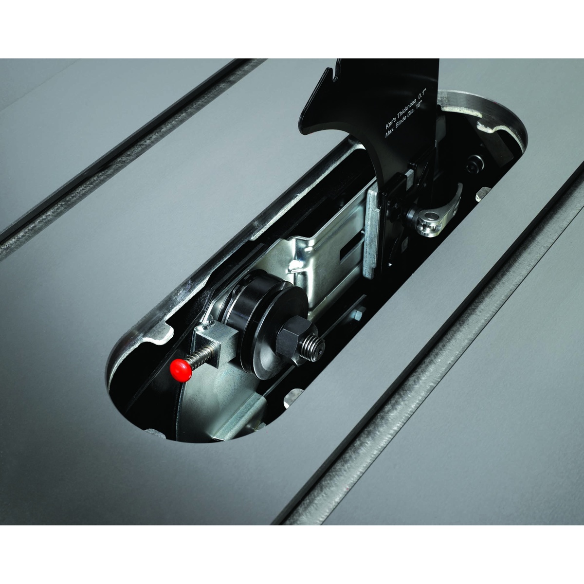 Jet 708675PK Deluxe Xacta SAW 3HP, 1Ph, 50 inch Rip arbor and internal mechanism visible through the throat opening during maintenance and blade change in a workshop