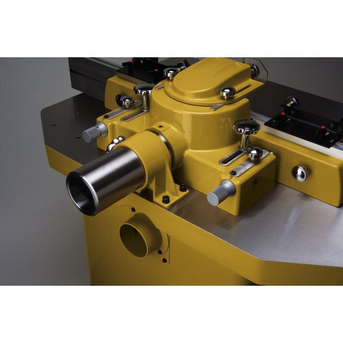 Powermatic 1280101C PM2700 Shaper, 5HP 1PH 230V rear detail showing dust collection port and heavy shaper body construction for shop dust management