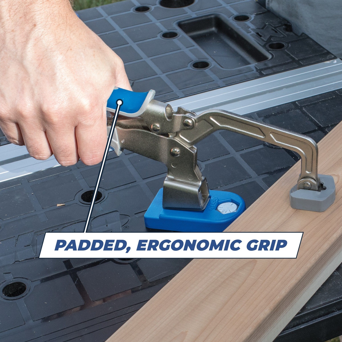 Kreg KBC3 3 in Bench Clamp holding a board on a work table during woodworking assembly with one-hand squeeze operation