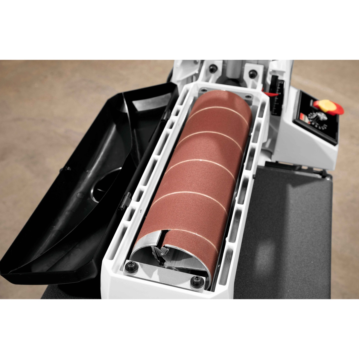 JET JWDS-1632 Drum Sander with Stand open drum housing showing abrasive wrap and removable drum during maintenance in a woodworking shop