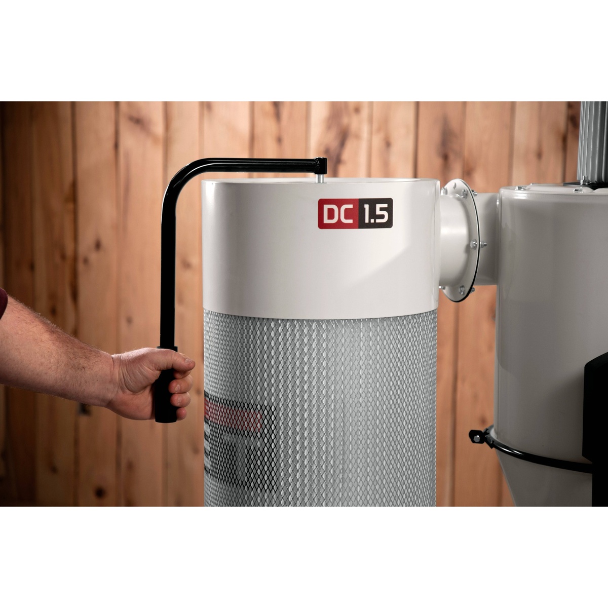 Jet JCDC-1.5 Cyclone Dust Collector, 1.5HP, 115V close-up of the manual filter cleaning handle on the canister in a workshop setting