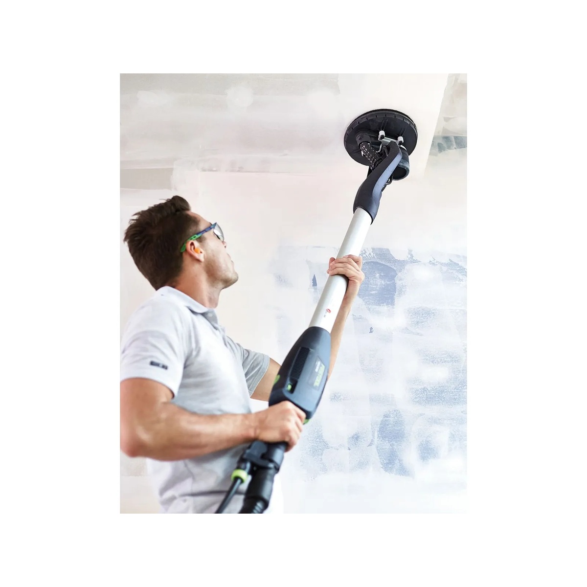 Festool 571935 Planex Easy Drywall Sander sanding a drywall ceiling in a renovation room for overhead finishing work