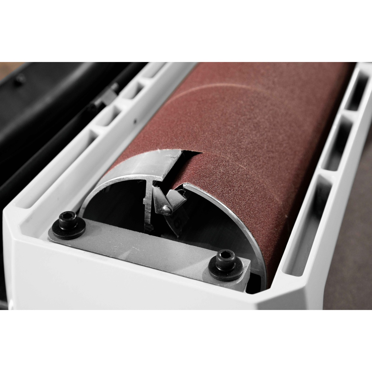 JET JWDS-1836 Drum Sander with Stand close-up of the sanding drum and abrasive take-up clip, showing quick abrasive change hardware for woodworking use