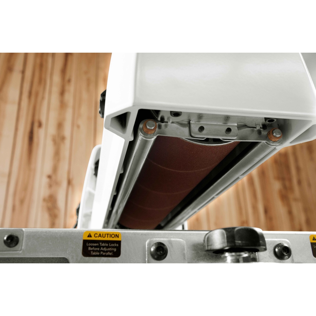 JET JWDS-1836 Drum Sander with Stand underside view of the aluminum sanding drum in a woodshop, showing the drum assembly used for consistent finish sanding