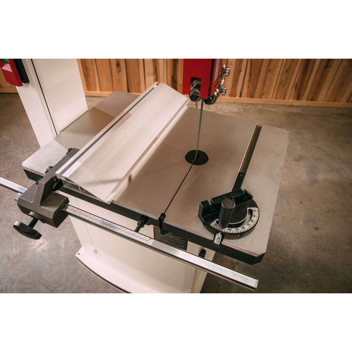 JET JWBS-15-3 15-Inch Woodworking Bandsaw cast iron table, fence, and tilt gauge set up for precision woodworking cuts in a shop