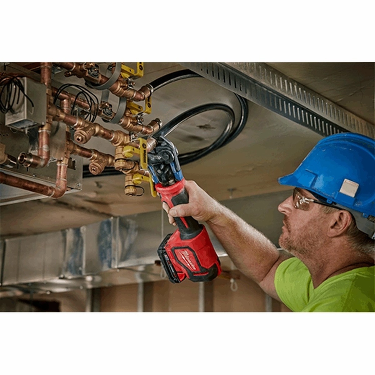 Milwaukee 2674-22P M18 Short Throw Press Tool Kit making an overhead plumbing press connection in a mechanical room