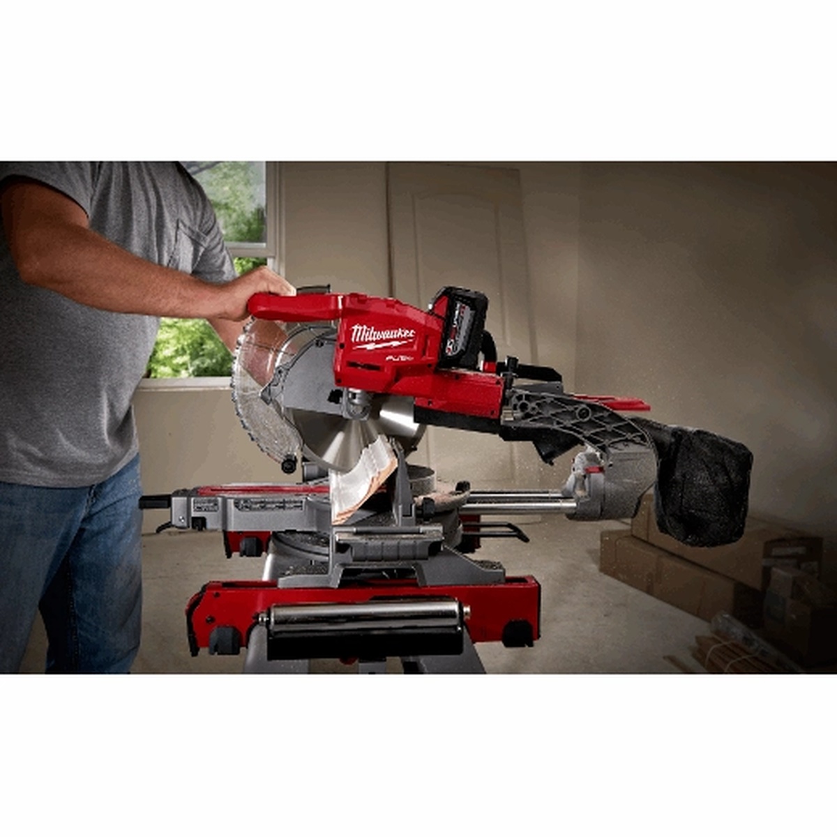 Milwaukee 2734-20 M18 FUEL 10 inch dual bevel sliding compound miter saw set up on a jobsite stand inside a remodel space for trim and crosscut work