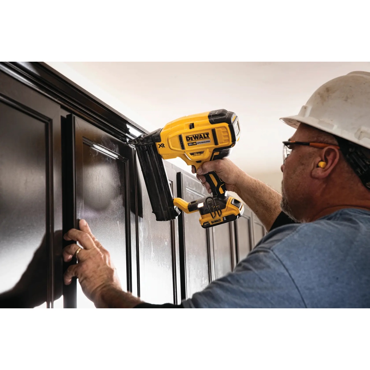 DEWALT DCN680B 20V MAX XR Cordless 18 Gauge Brad Nailer driving brads into cabinet trim with close control near finished edges