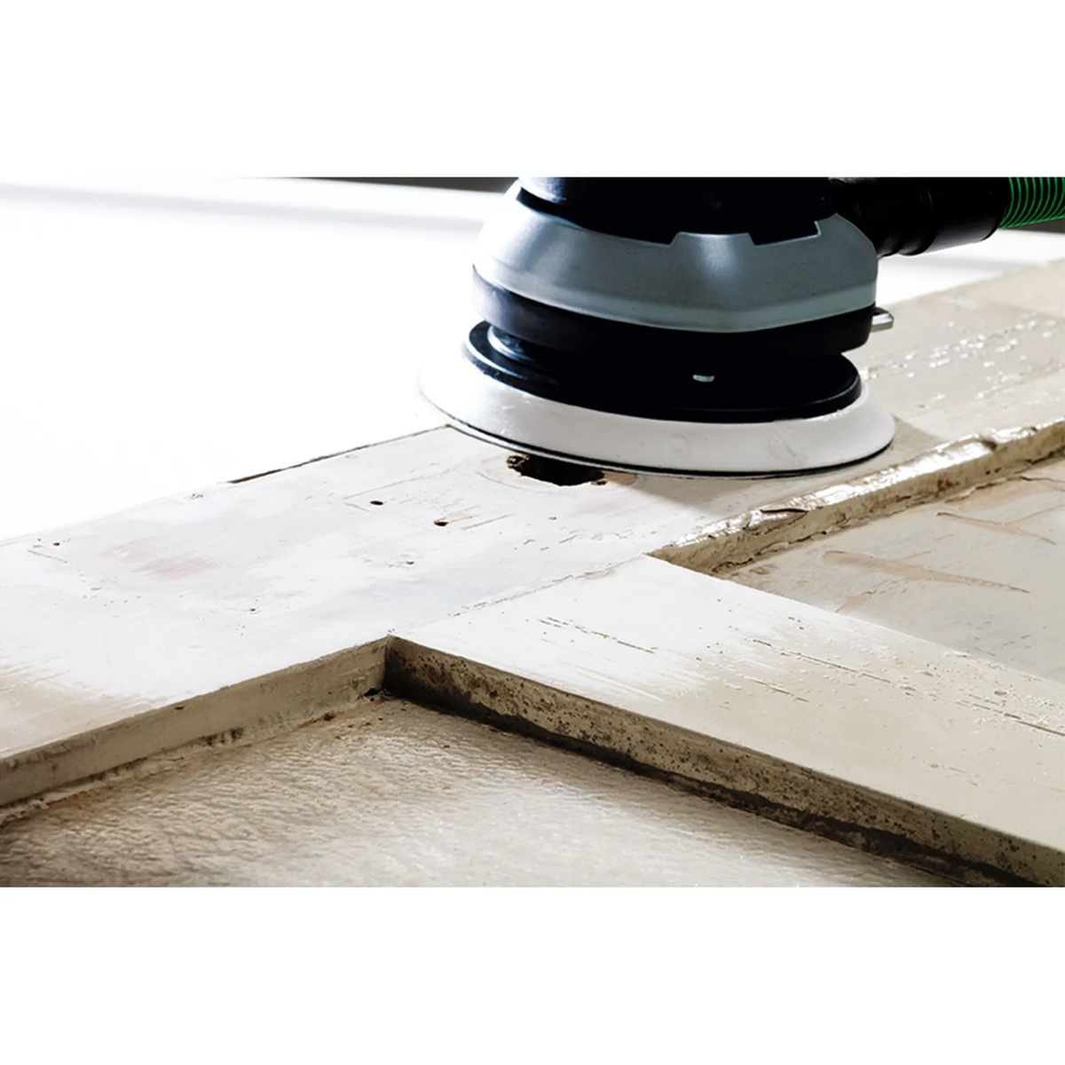 Festool PP D150/2 Protection Pad installed on a 6 inch Festool sander while sanding a painted wood panel during surface preparation