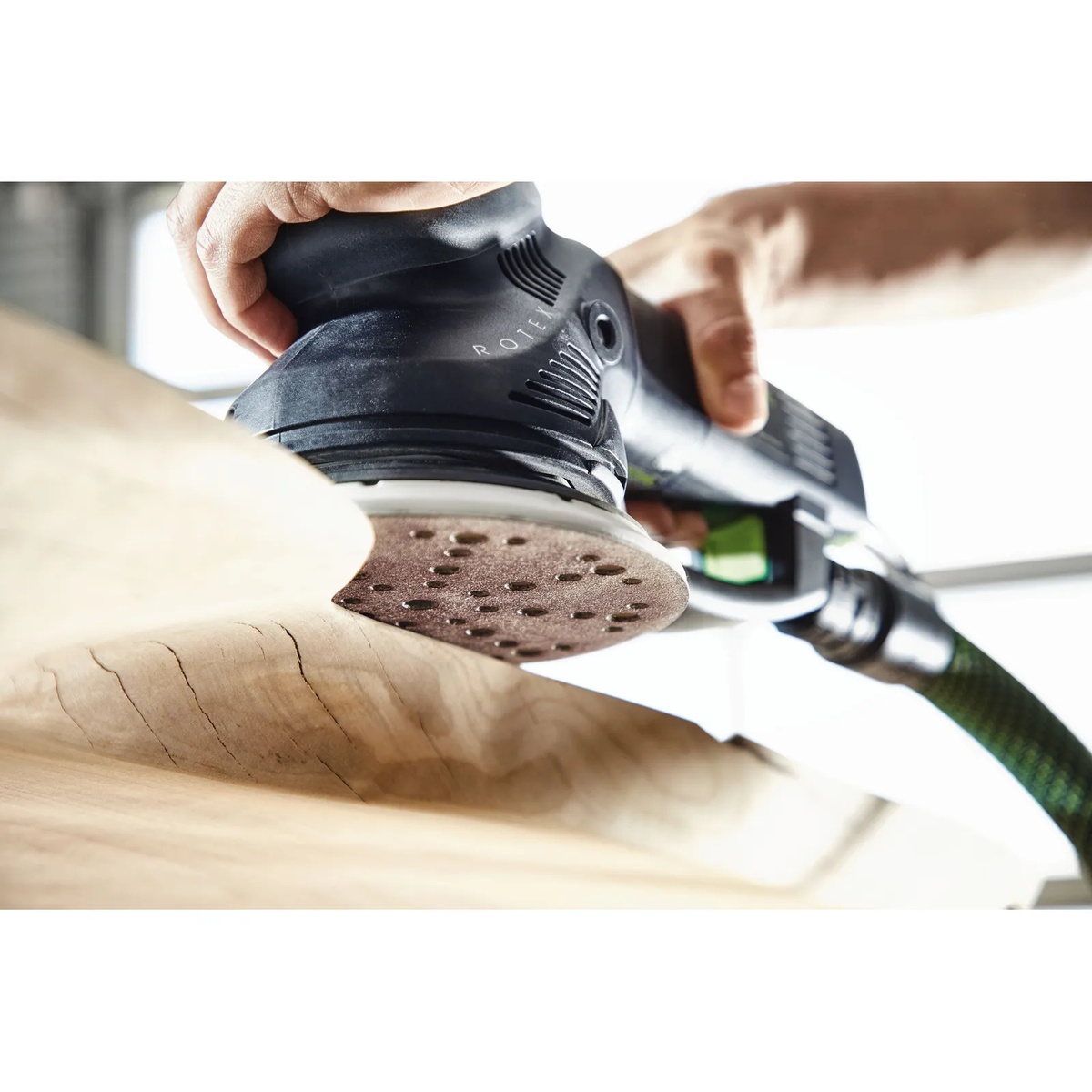 Festool 202463 Multi Jetstream2 150mm hard pad installed on a Rotex RO 150 FEQ sander while sanding a wood slab in a shop setting