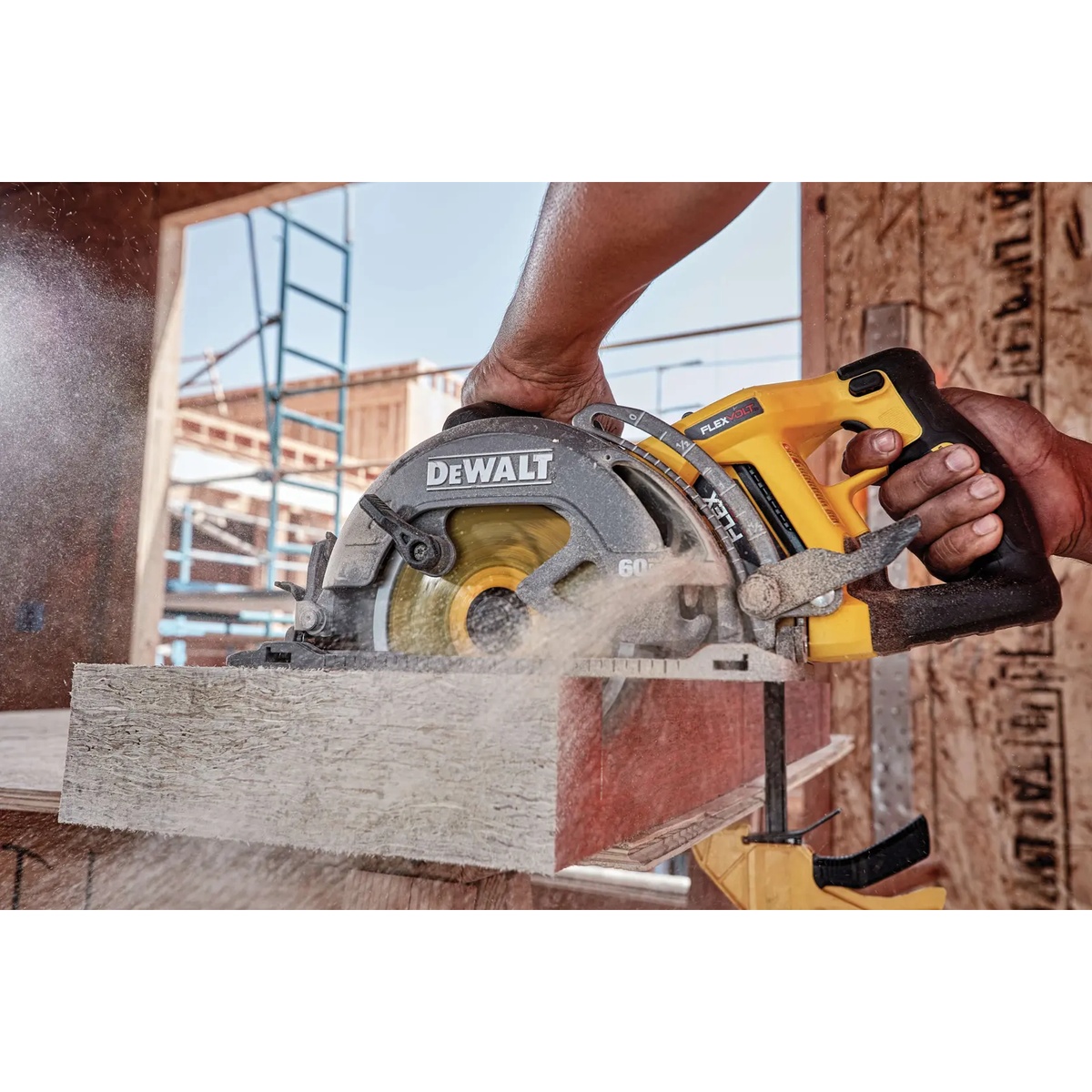 DEWALT DCS577B FLEXVOLT 60V MAX 7-1/4 in. Cordless Worm Drive Style Saw making a deep bevel cut through framing material inside a building shell