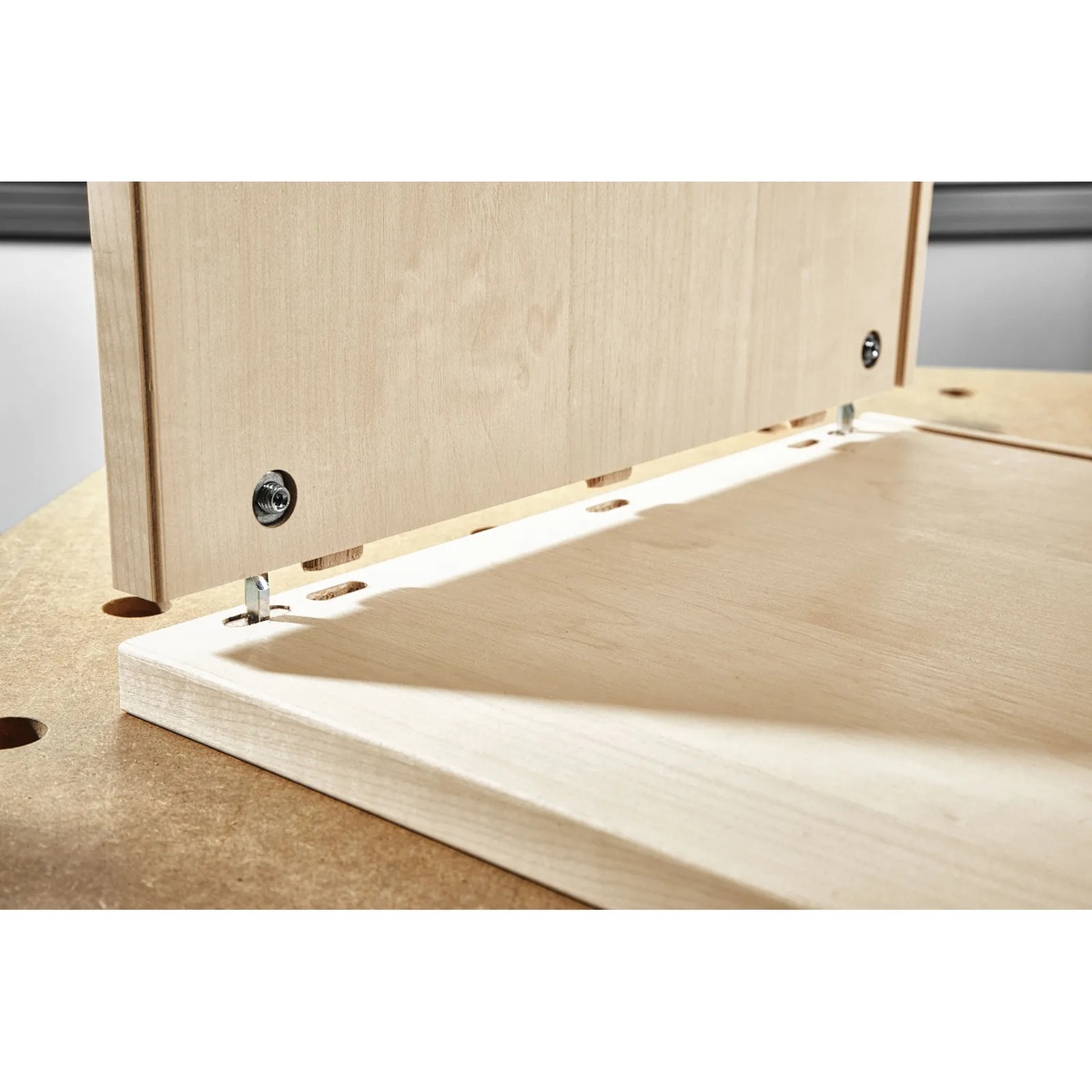 Festool 203166 Domino DF 500 8mm Panel Connector, 50-Pack aligning cabinet panels during knock-down furniture assembly on a workbench