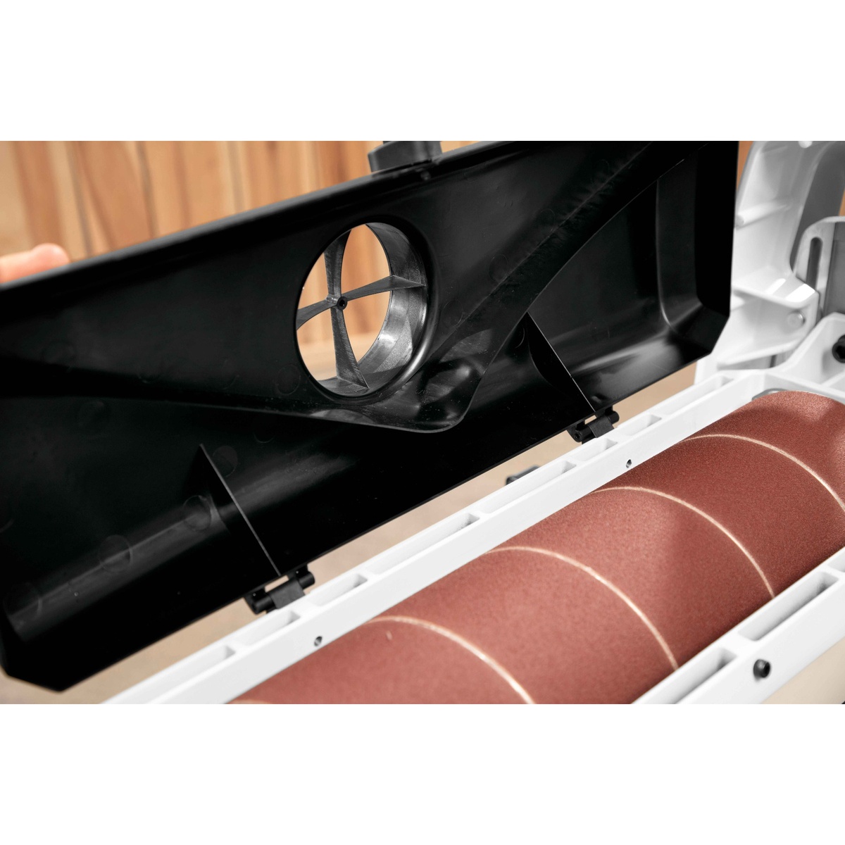 Jet 723540OSK JWDS-2244 Drum Sander With Stand mirrored dust hood and 4 inch dust port directing sanding dust during woodworking