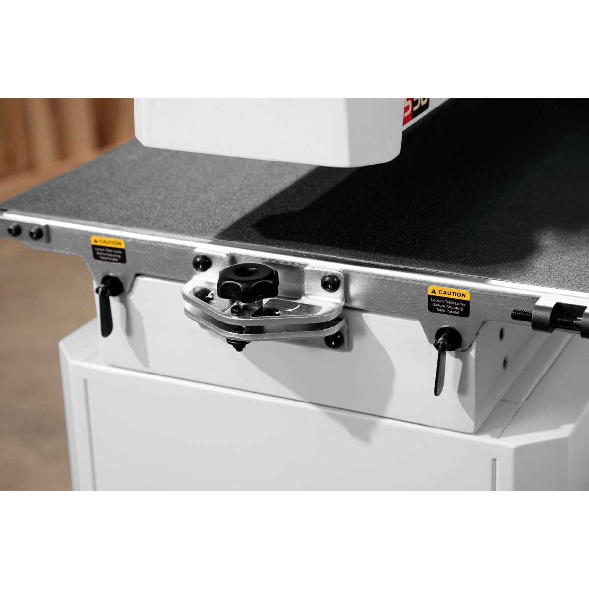 Jet 723540OSK JWDS-2244 Drum Sander With Stand parallelism adjustment dial on the conveyor bed for fine tuning in a woodshop