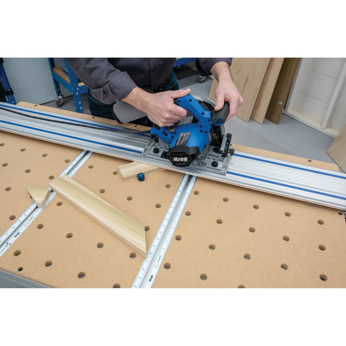 Kreg ACS1000 Adaptive Cutting System Project Table Kit close-up showing guide rail alignment over the tabletop hole grid for repeatable cuts