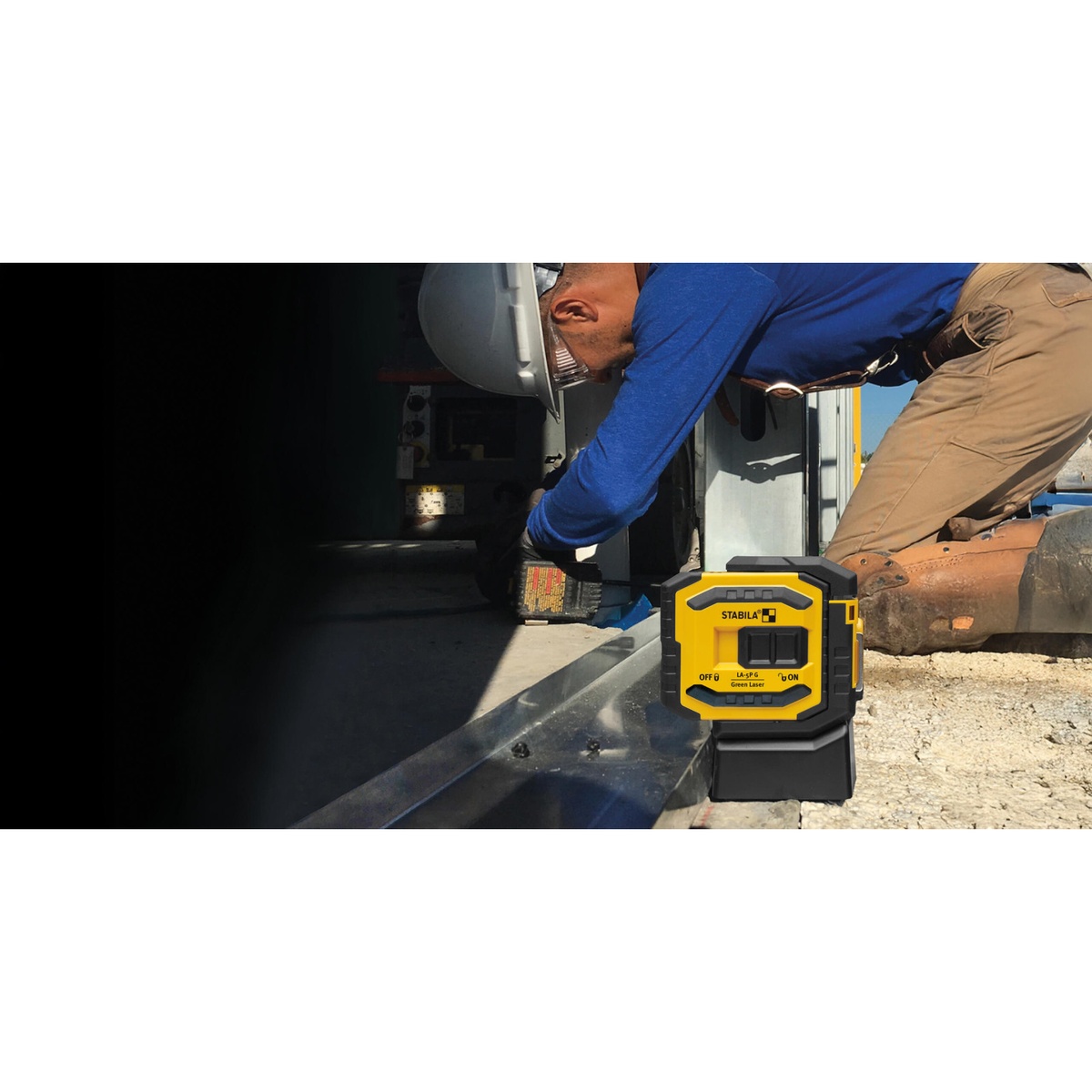 Stabila 03165 LA-5P Green 5 Point Laser Level Set being used outdoors near metal framing during construction layout work