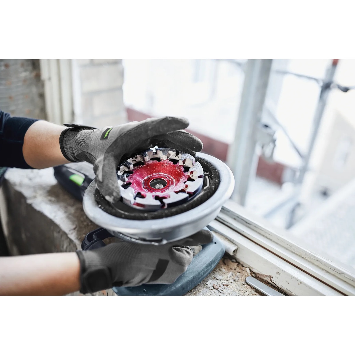 Festool 768018 DIA ABRASIVE-D130 PREMIUM Diamond Disc installed on an RG 130 grinder during window-area renovation work on abrasive masonry material
