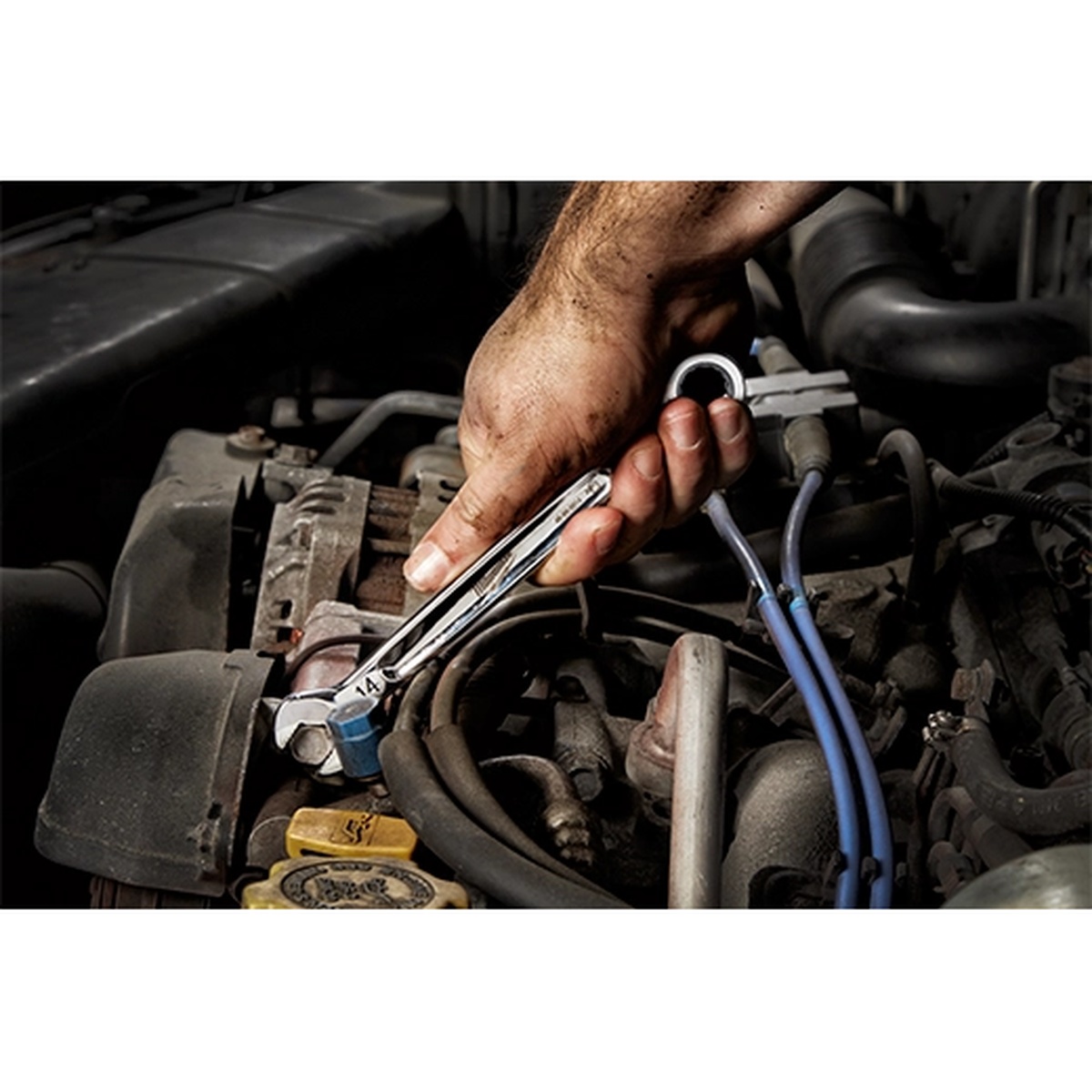Milwaukee 48-22-9516 15pc Metric Ratcheting Combination Wrench Set being used on an automotive engine fastener in a tight under-hood service area