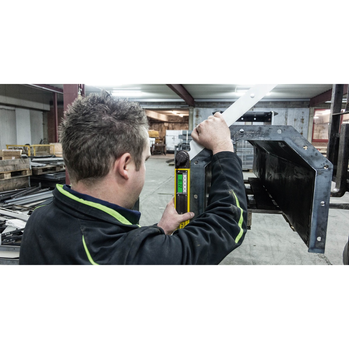 Stabila 39018 18-inch Digital Angle Finder TECH 700 DA measuring and transferring an angle on a fabricated metal component in a workshop