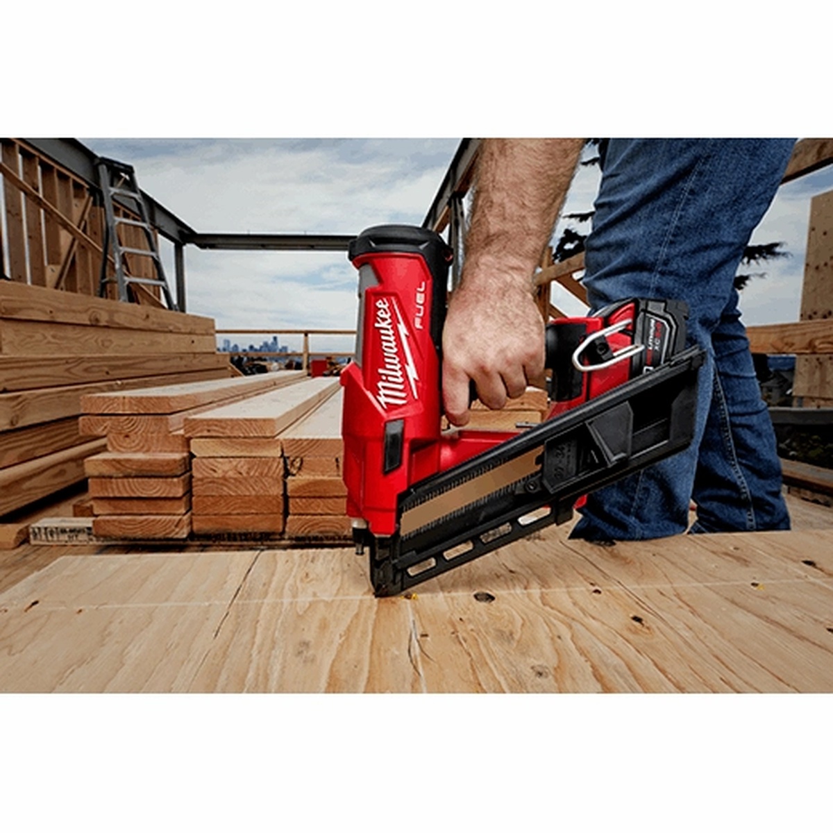 Milwaukee 2745-21 M18 FUEL 30 Degree Framing Nailer Kit driving a fastener into subfloor plywood on an active framing jobsite