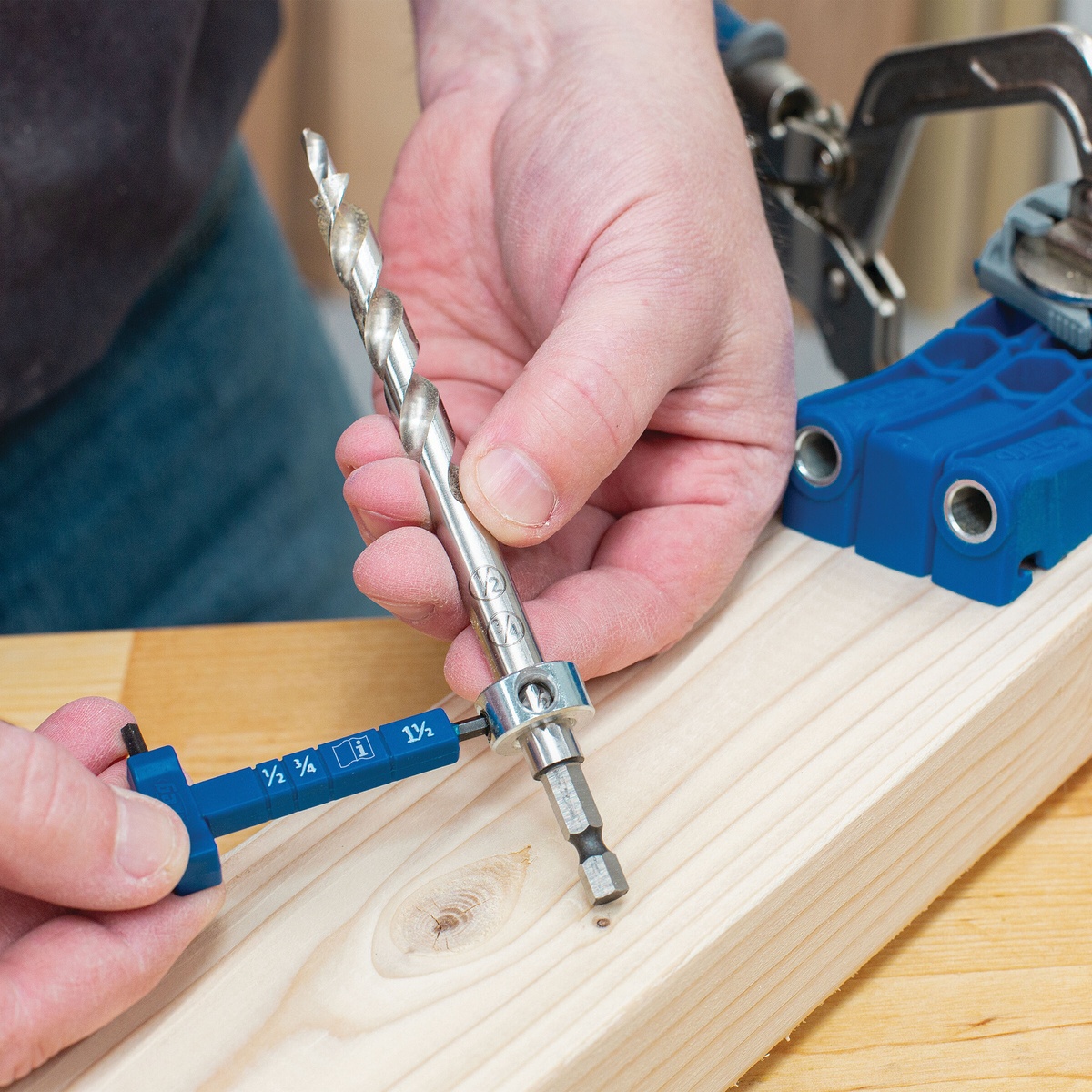 Kreg KPHA308 Easy-Set Drill Bit with Stop Collar & Gauge/Hex Wrench being set up on a wood board next to a Kreg pocket-hole jig for pocket-hole drilling