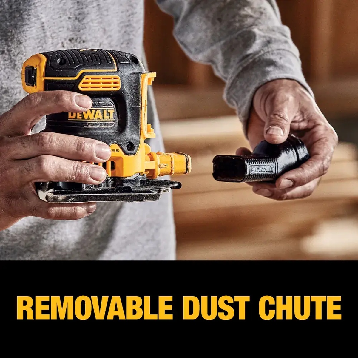 DEWALT DCW200B 20V MAX XR Brushless Cordless 1/4 Sheet Variable Speed Sander with removable dust chute being detached by hand in a woodworking shop setting