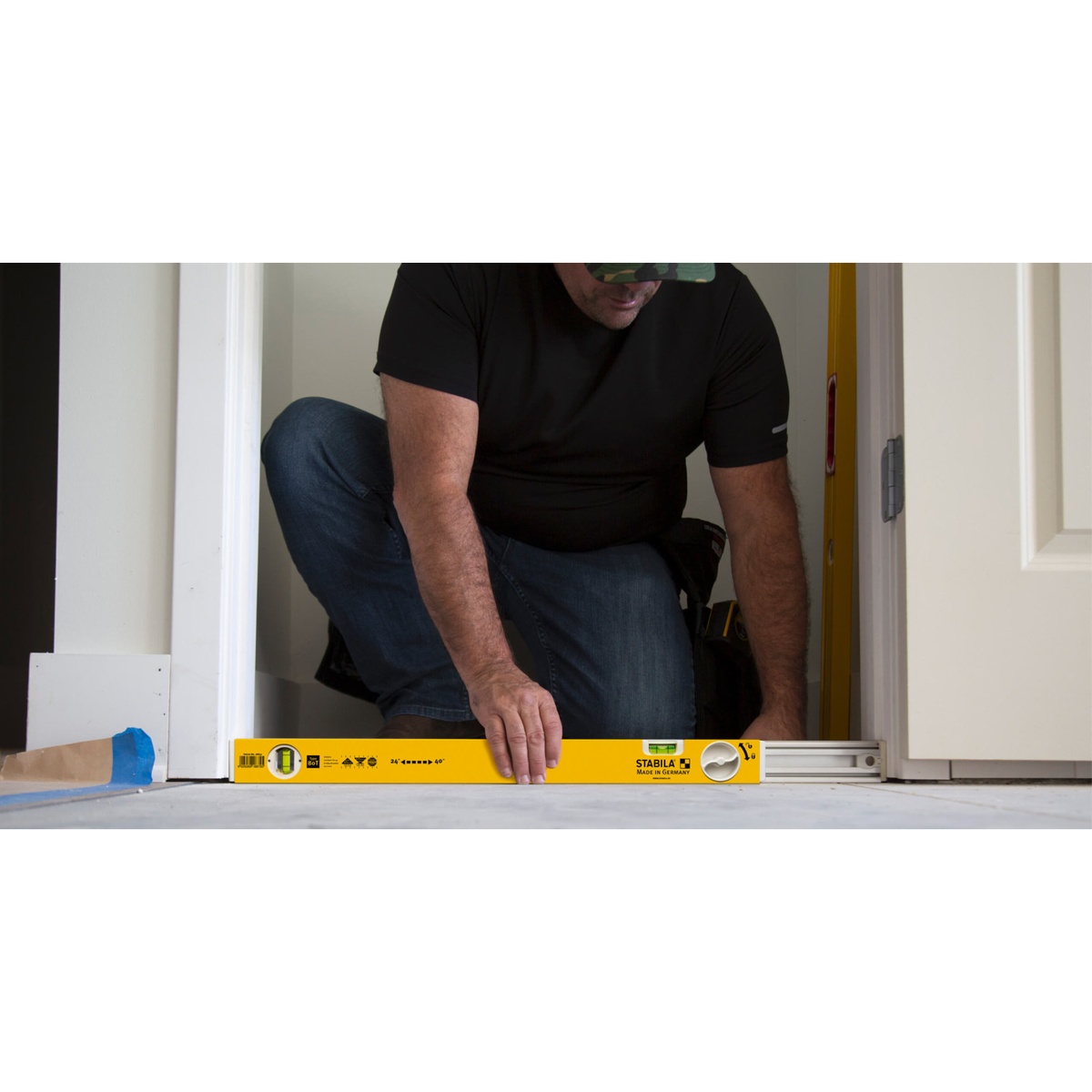 Stabila 37540 Type-196 78-inch Level and Type-80 T Extendable Level Jamber Set extendable header level locked to fit a doorway during floor-level opening setup