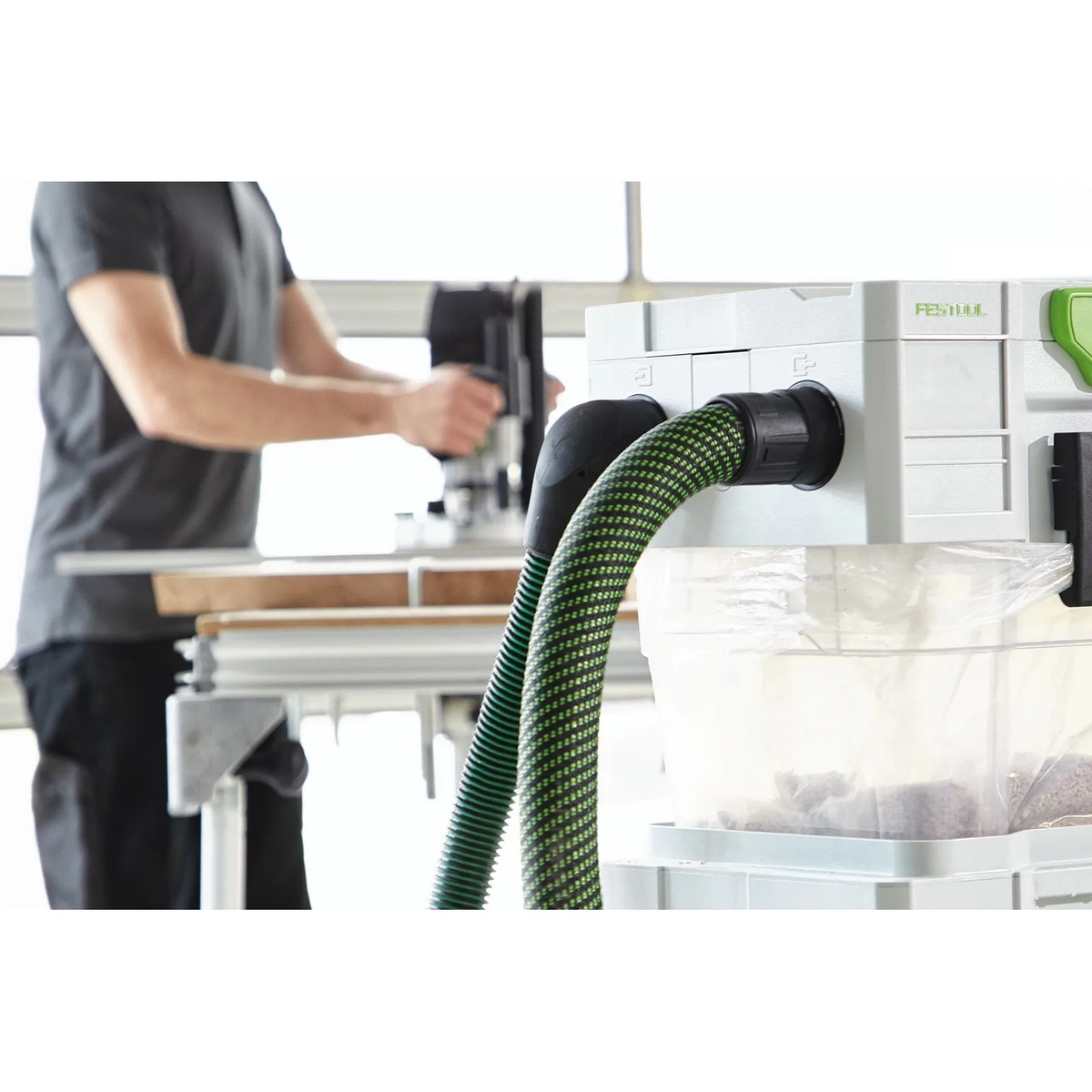 Festool 204926 Suction hose D36x7m-AS/CTR attached to a Festool CT extractor inlet in a workshop dust collection setup