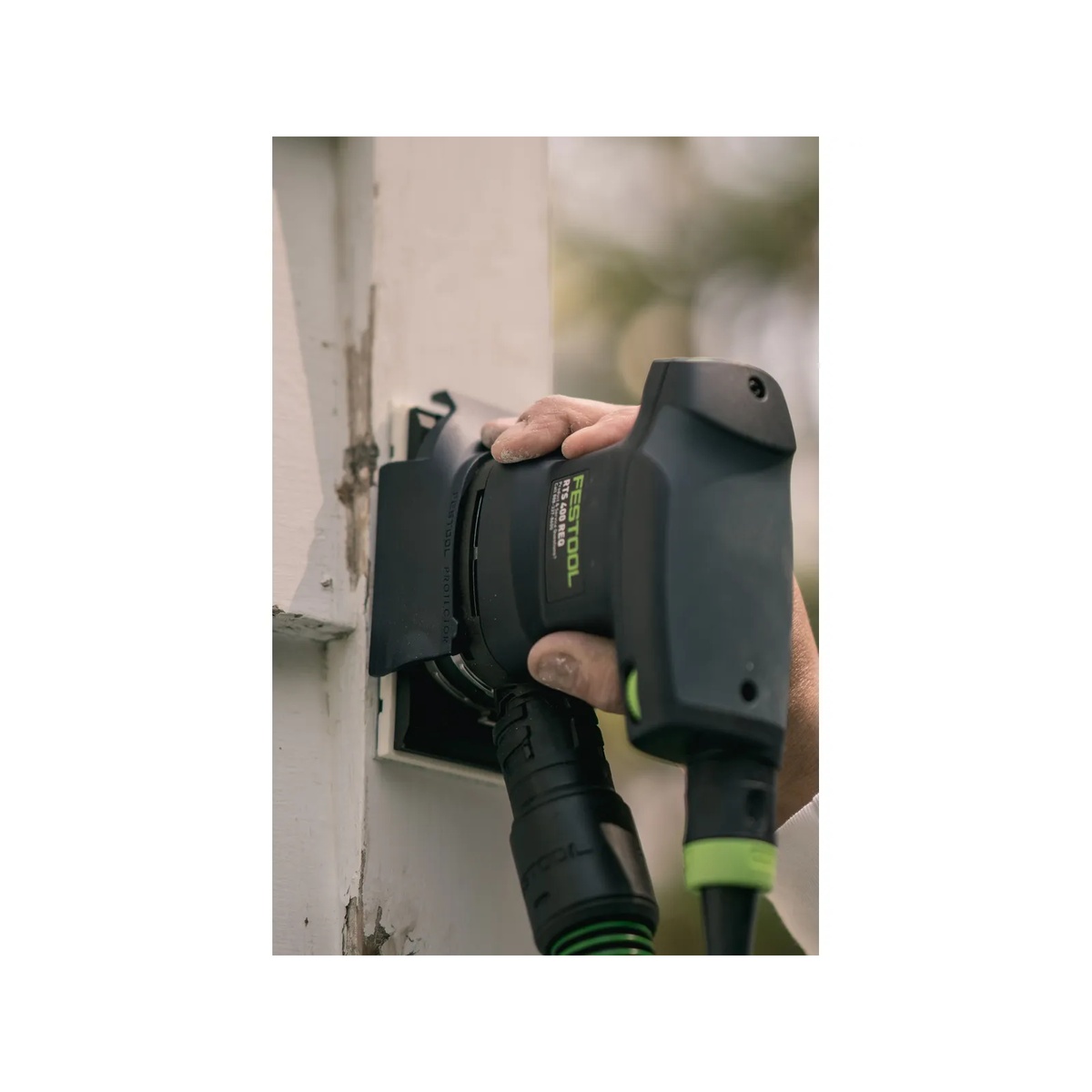 Festool 576054 RTS 400 REQ Orbital Sander sanding a painted window frame vertically during restoration work