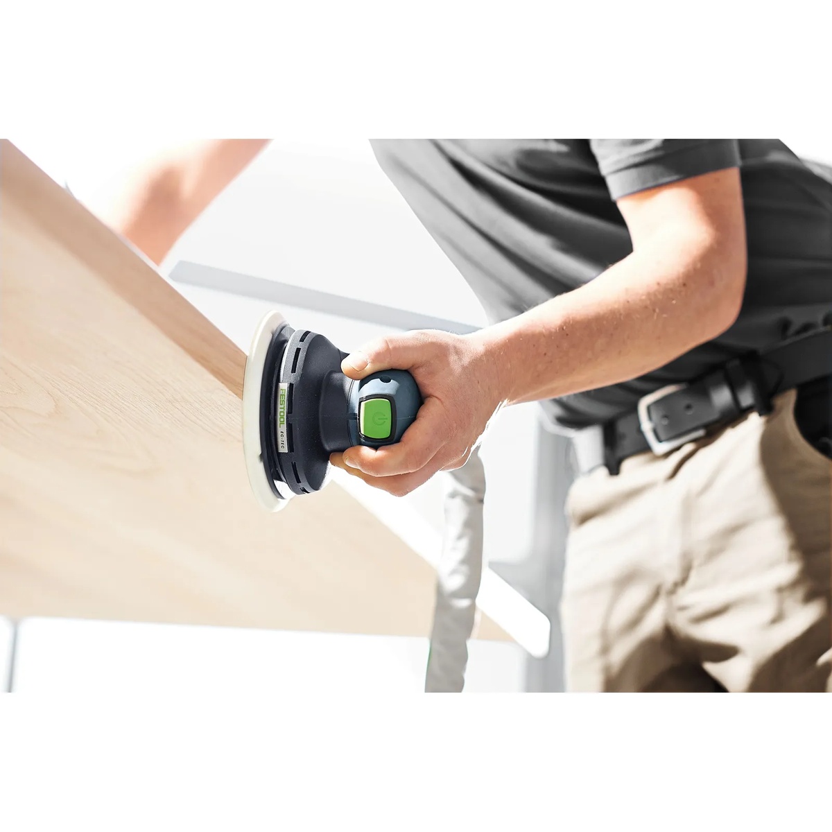 Festool ETS EC150/3 EQ-Plus Random Orbital Sander sanding a vertical wood panel during finish prep work